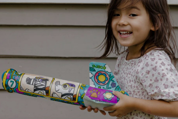 Girl holding Djeco Rocket Craft